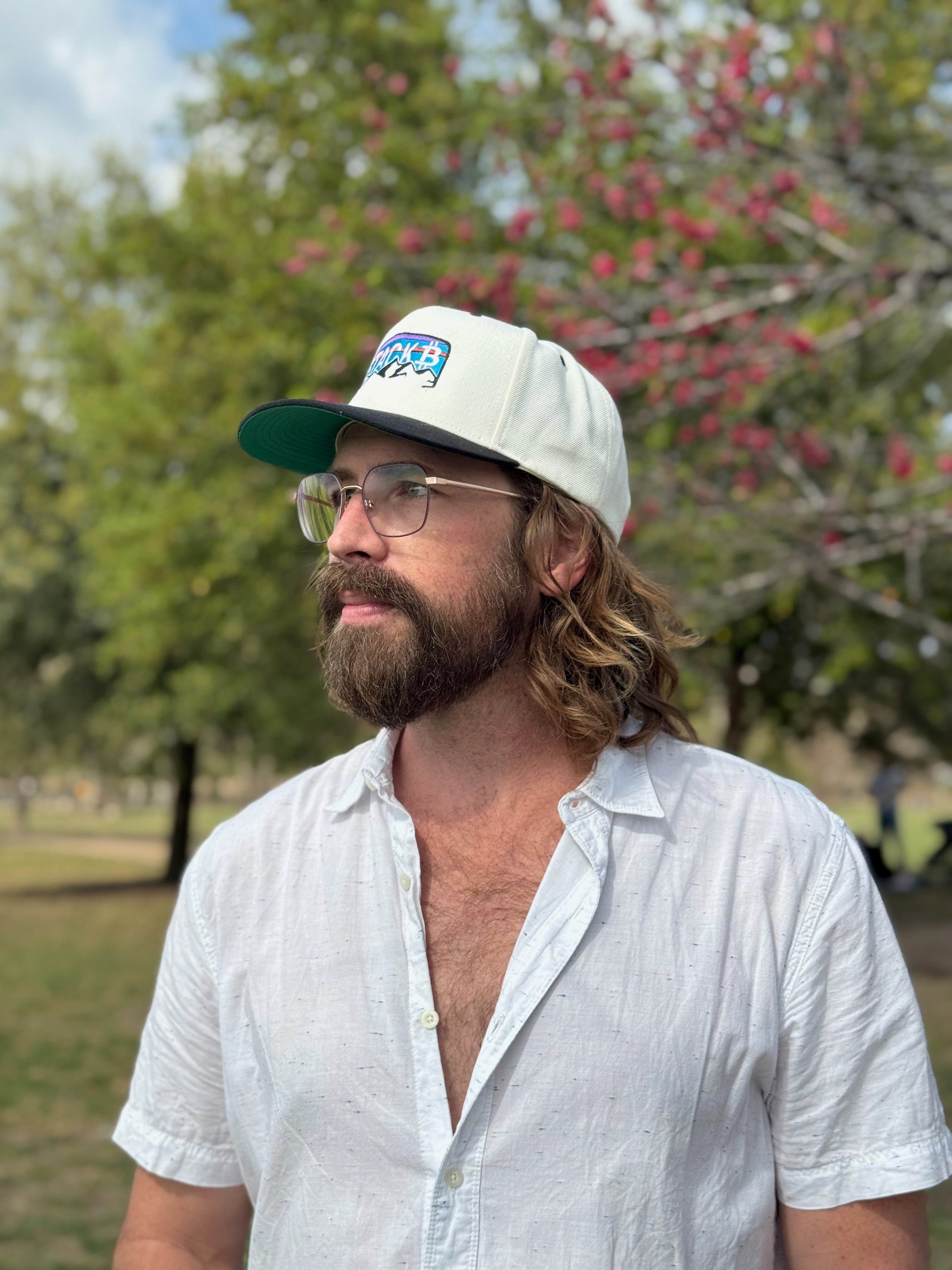 Man wearing Stack Bitcoin hat in cream and black