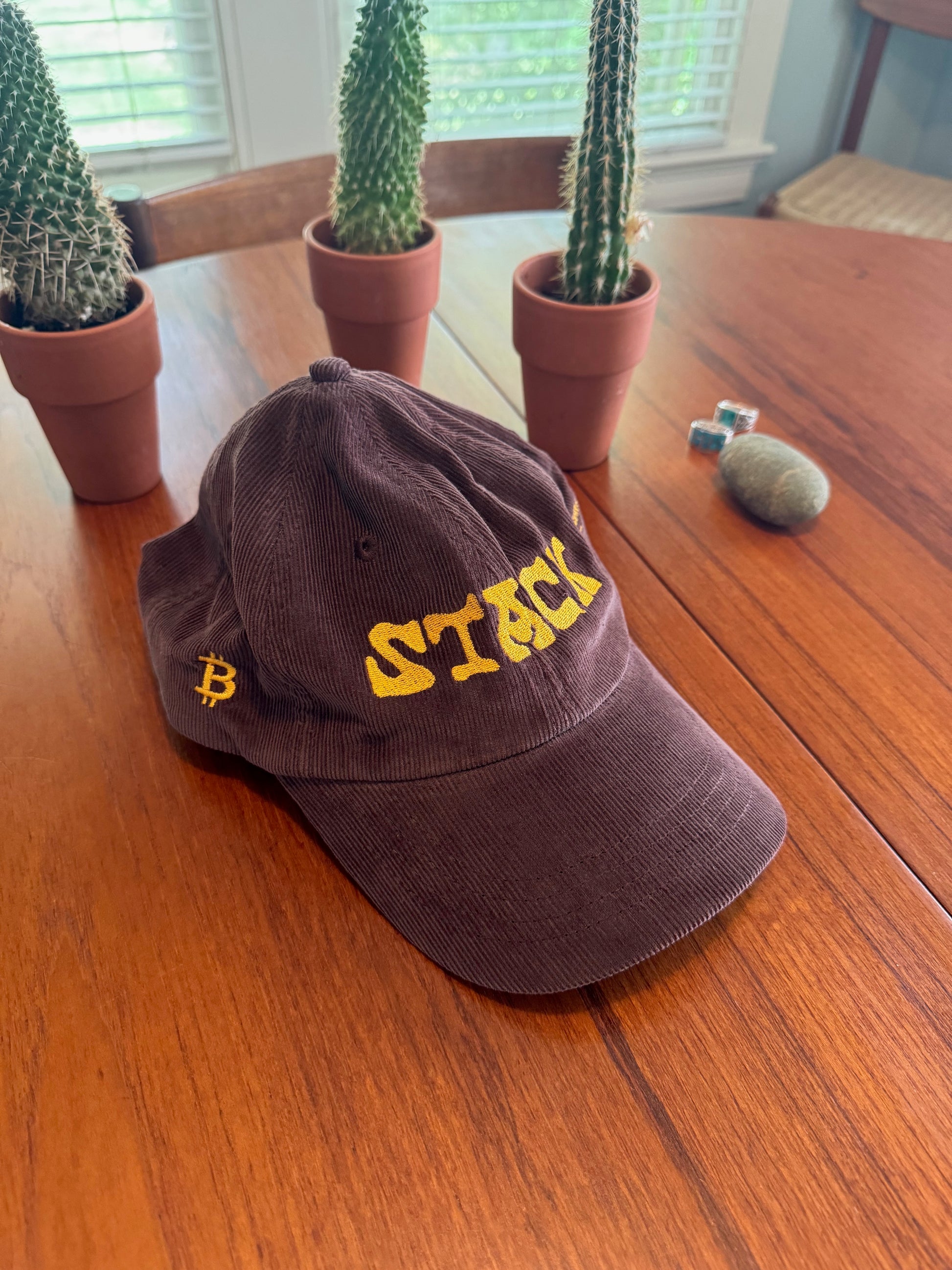 Brown corduroy cap with yellow 'Stack' text and bitcoin logo for retro style - Sovereign Goods.
